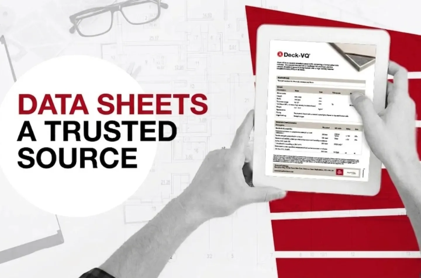 Tablet held in hands showing a data sheet, red and white background.