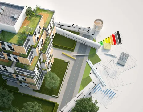 Sustainable building with green roofs and architectural plans.